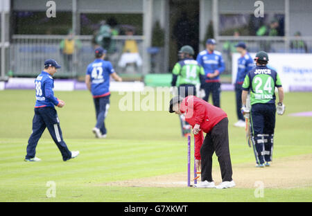The bales are removed by the umpire signaling a break in play for rain during the One Day International at The Village, Dublin, Ireland. Stock Photo