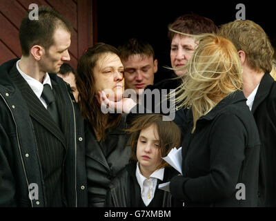 Andrew Morton (L), Father of Two-year-old Andrew Morton and mother, Sharon McMillan (centre) outside St Dominic's church. Stock Photo