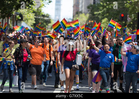 San Francisco, USA. 26th June, 2016. Marchers in the 2016 Pride Parade wave rainbow flags. Credit:  John Orvis/Alamy Live News Stock Photo