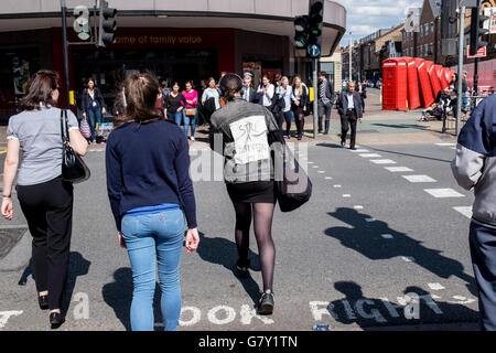 Kingston-upon-Thames, UK. 27th June, 2016. A young woman dressed in black denim and leggings has pinned a homemade sign on her back reading “Still A European” as she walks through Kingston-upon-Thames shopping centre Credit:  On Sight Photographic/Alamy Live News Stock Photo