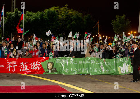 Asuncion, Paraguay. 27th June, 2016. Taiwanese expatriates in Paraguay, Brazil and Argentina wave flags as they wait Taiwan's President Tsai Ing-wen at Silvio Pettirossi International Airport, Luque, Paraguay. Credit:  Andre M. Chang/ARDUOPRESS/Alamy Live News Stock Photo