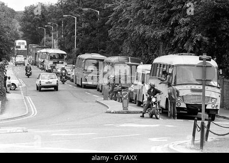 A hippie convoy moves through the town centre of Marlborough after leaving a forest camp site, where they were given an eviction deadline. They are now travelling to Stonehenge. Stock Photo
