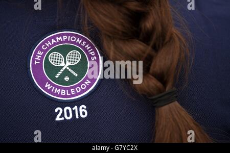 Detailed view of the emblem and badge for the Wimbledon Championships on the back of a ball girl's T-shirt before the start of the 2016 Wimbledon Championships. Stock Photo