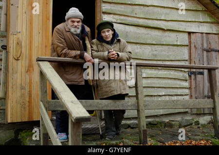 Homeless couple in front of a forest hut, in a wood near Carlsbad, Karlovy Vary, Czech Republic, Europe Stock Photo