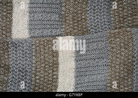 Close up of knitted gray beige shawl scarf Stock Photo