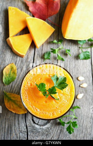 Pumpkin smoothie on wooden background, top view Stock Photo
