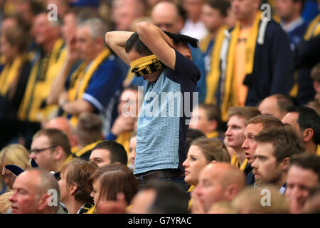 Soccer - Sky Bet League Two - Play Off - Final - Southend United v Wycombe Wanderers - Wembley Stadium. A Southend United fan covers his eyes in the stands.
