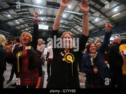 SNP supporters celebrate as Alex Salmond Scottish National Party parliamentary candidate for the Gordon constituency after it was announced he won his seat at the Aberdeen Exhibition and Conference Centre in Aberdeen. Stock Photo