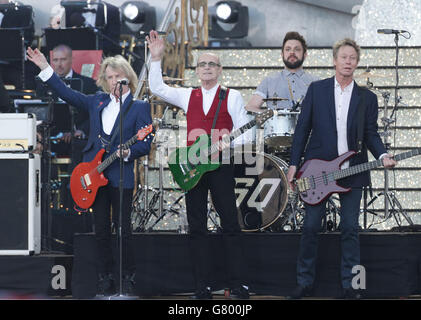 Rick Parfitt (left) and Francis Rossi (centre) of Status Quo during the VE Day 70: A Party to Remember concert on Horse Guards Parade, Whitehall, London. Stock Photo
