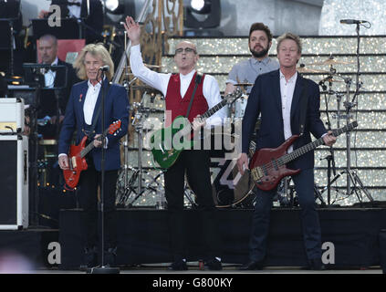 Rick Parfitt (left), Francis Rossi (centre) and John Edwards of Status Quo during the VE Day 70: A Party to Remember concert on Horse Guards Parade, Whitehall, London. Stock Photo