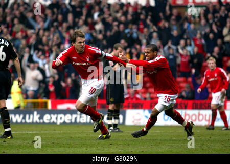 Soccer - Coca-Cola Football League Championship - Nottingham Forest v Wigan Athletic - City Ground. Gareth Taylor celebrates after scoring Nottingham Forest's equalising goal against Wigan Athletic. Kevin James tries to join in. Stock Photo