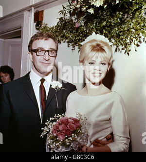 English actor Peter Sellers and Swedish actress Britt Ekland pictured after their wedding at Guildford registery office, Surrey. The couple had known each other only a month. The bride is wearing a gown by Norman Hartnell and she carries pink roses and lillies of the valley. Her hat is a small pillbox covered in white fantasy flowers. Sellers wears a dark blue suit. After the ceremony, more than 1000 fans came to see the couple leave in their car. Stock Photo
