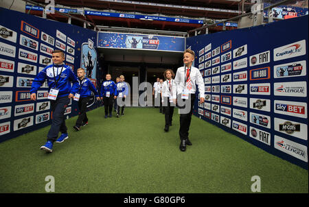 Oldham Athletic represented by South Failsworth Primary school (left) and Crawley Town represented by The Oaks Primary school walk out the tunnel prior to the Kinder+Sport Football League Kids Cup Final Stock Photo