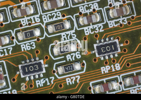 Concept - computer technology / cpu / system architecture. Socket 7 components below CPU chip. Wiring inside computer, circuit close up. Stock Photo