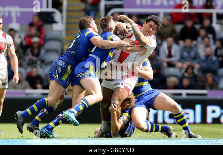 Rugby League - Magic Weekend - St Helens v Warrington Wolves - St James' Park. St. Helens Mose Masoe is tackled by Warrington's defence during the Magic Weekend match at St James' Park, Newcastle. Stock Photo