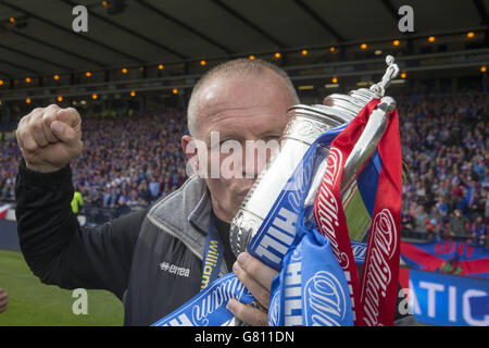 Inverness Caledonian Thistle manager John Hughes celebrates with the William Hill Scottish Cup trophy Stock Photo