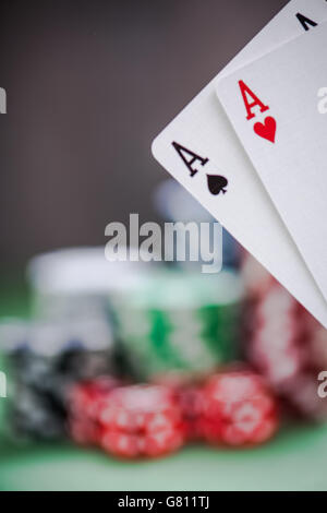 winning aces cards in poker game, blurred background Stock Photo