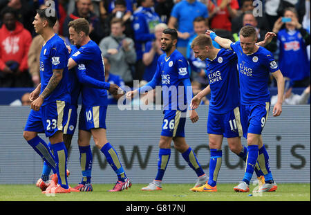 Leicester City's Marc Albrighton (second right) celebrates scoring his teams second goal with team mates during the Barclays Premier League match at the King Power Stadium, Leicester. Stock Photo