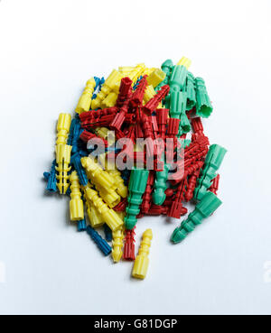 Bunch of colored plastic dowels isolated on white background Stock Photo