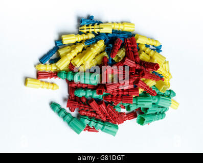 Bunch of colored plastic dowels isolated on white background Stock Photo