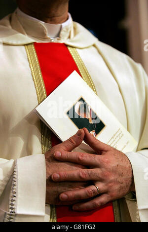 A priest in the Pro-Cathedral, at a Solemn Mass of Remembrance for the late Pope John Paul ll who died on Saturday. Stock Photo