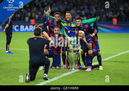 Barcelona's Jordi Alba (bottom left), Neymar (bottom right), Rafinha (top right), Adriano (centre) celebrate with the UEFA Champions League Trophy. Stock Photo