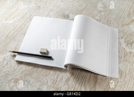 Blank opened brochure with a pencil and eraser Stock Photo