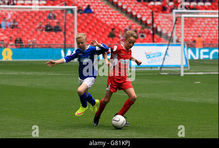 A general view of the action between The Oaks Primary school and South Failsworth Primary school during the Kinder+Sport Football League Kids Cup Final Stock Photo