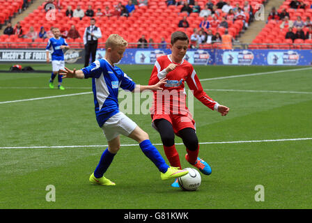 A general view of the action between The Oaks Primary school and South Failsworth Primary school during the Kinder+Sport Football League Kids Cup Final Stock Photo