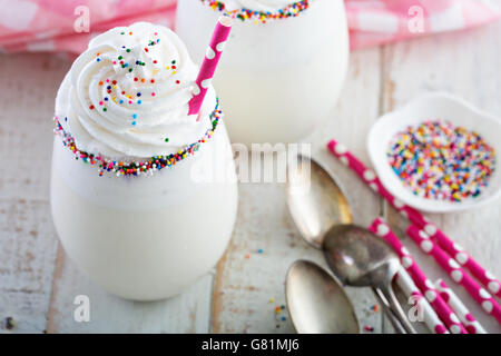 Vanilla milkshake with whipped cream and sprinkles Stock Photo