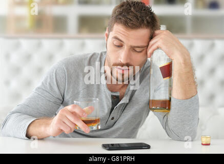 man with whiskey in glass Stock Photo