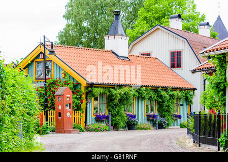 Soderkoping, Sweden - June 20, 2016: 18th century house in the corner of Trangsundsgrand in the Drothem area. Small and fairytal Stock Photo