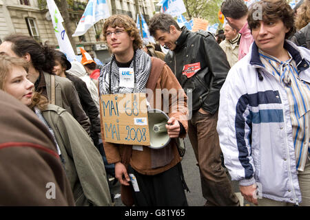 17 year-old high school student Adrien Derain (with sign takes part in the traditional May Day demonstration, 2008 Paris France Stock Photo