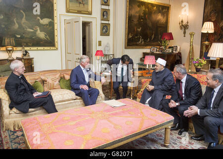 The Prince of Wales (centre) receives the Grand Imam of Al-Azhar, Professor Dr. Mohamed Ahmed el-Tayeb (3rd right) and the Archbishop of Canterbury the Most Reverend Justin Welby (left) at Clarence House in London. Stock Photo