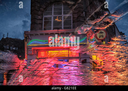 UK,London,Old Compton street ,Soho- Reflections of Ed's Easy Diner on the pavement after rain at night Stock Photo