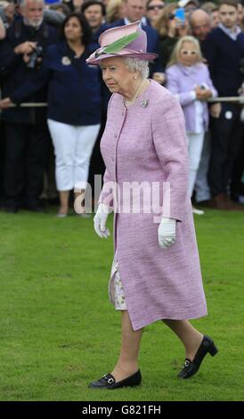 Queen Elizabeth II prepares to present trophies and the Queen's Cup at the Cartier Queen's Cup polo tournament final at Guards Polo in Windsor Great Park, Berkshire. Picture date: Sunday June 14, 2015. See PA story ROYAL Polo. Photo credit should read: Jonathan Brady/PA Wire Stock Photo