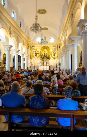 Full Catholic church interior, during mass, Fuengirola, Andalusia, Spain. Stock Photo