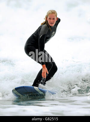 Bethany Hamilton, 15, on the beach at Watergate Bay, near Newquay, where she was teaching new Blue Peter presenter Gethin Jones, 26, to surf for a future episode of the children's TV programme. Stock Photo