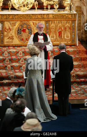 The Prince Of Wales and his new bride the Duchess of Cornwall stand in front of Dr Rowan Williams, the Archbishop of Canterbury during the Service of Prayer and Dedication in St George's Chapel, Windsor Castle. Stock Photo