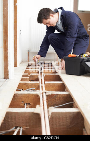 Male Plumber Fitting Central Heating System Stock Photo