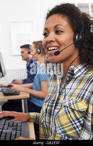 Female Customer Services Agent In Call Centre Stock Photo