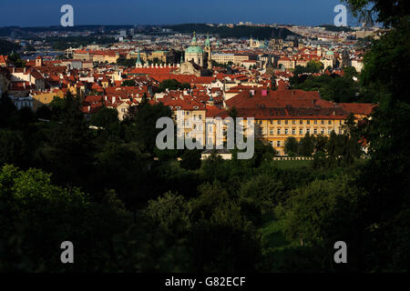 A view looking out over Prague, including St Nicholas church (centre). Stock Photo