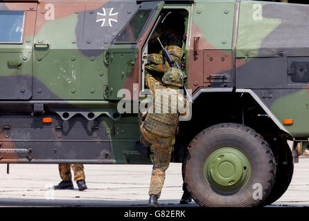 BURG / GERMANY - JUNE 25, 2016: german soldier is moving into military infantry vehicle, Dingo on open day in barrack burg / ger Stock Photo