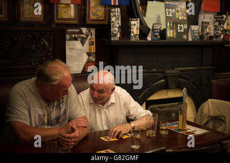 enjoying a drink in The Horse Shoe bar, Glasgow, Scotland, UK.