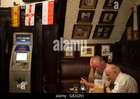 enjoying a drink in The Horse Shoe bar, Glasgow, Scotland, UK.
