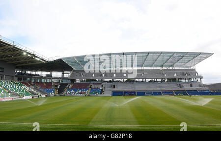 Ground staff prepare the Windsor Park pitch before UEFA European Championship Qualifying game between Northern Ireland and Romania, at Windsor Park, Belfast. Stock Photo