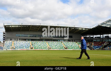 Ground staff prepare the Windsor Park pitch before UEFA European Championship Qualifying game between Northern Ireland and Romania, at Windsor Park, Belfast. Stock Photo