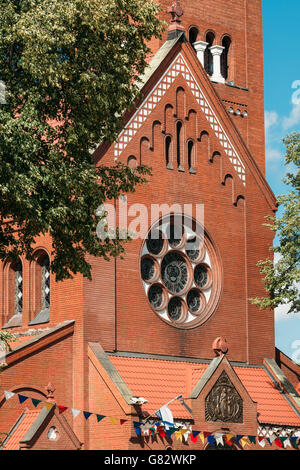 Church Of Saints Simon And Helen or Red Church On Independence Square In Minsk, Belarus Stock Photo