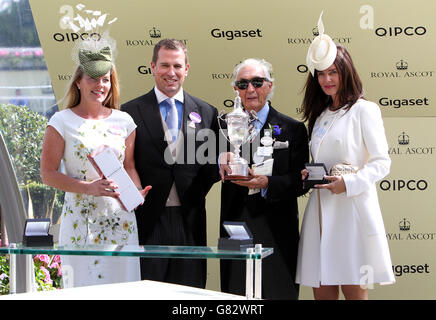 Winning owner Sir Robert Ogden (right) holds the trophy alongside Peter Phillips after Amazing Maria wins the Duke Of Cambridge Stakes during day two of the 2015 Royal Ascot Meeting at Ascot Racecourse, Berkshire. Stock Photo