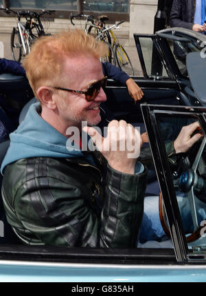 Chris Evans leaves the BBC Radio studios in London, in his vintage Aston Martin, after he was announced as the new Top Gear presenter. Stock Photo